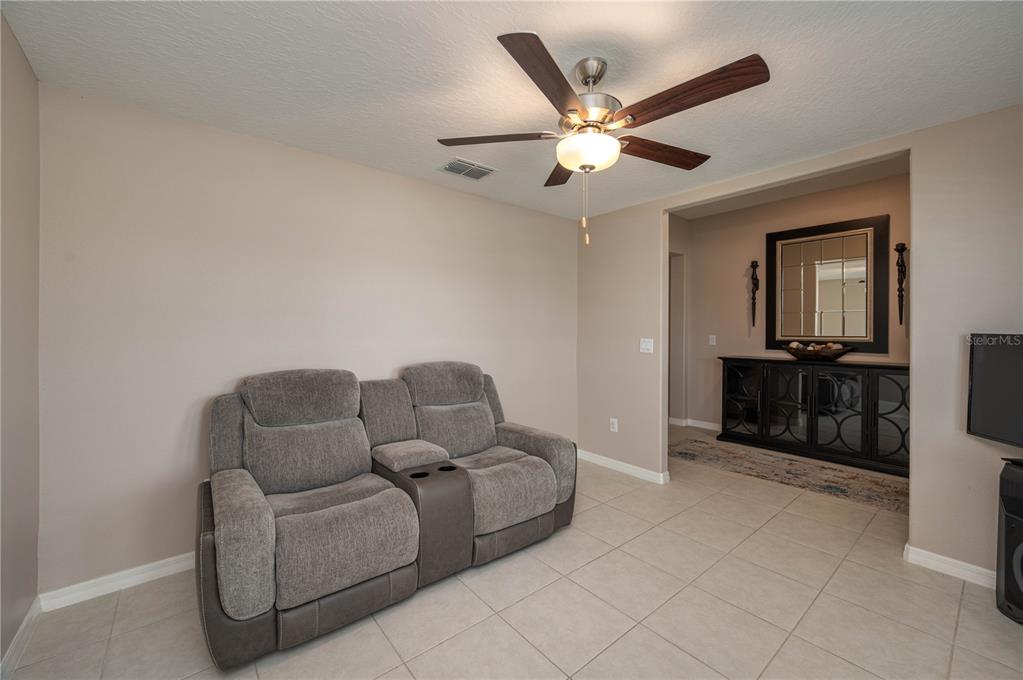2958 Flying Blackbird Road Bartow, FL 33830 - Photo 3 of 28 a living room with furniture and a ceiling fan
