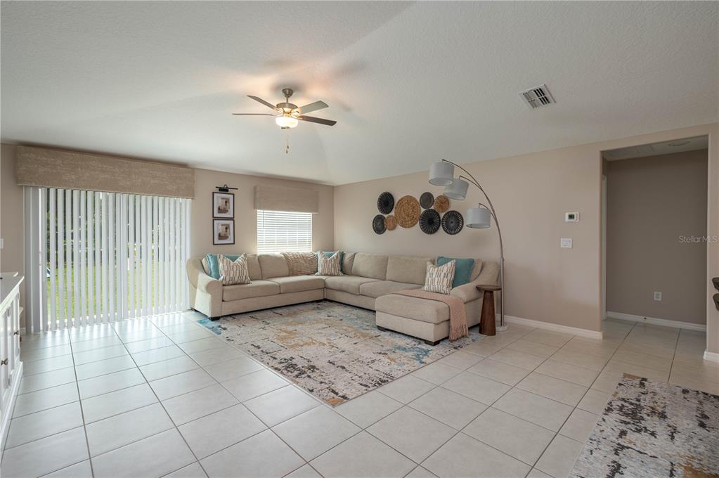 2958 Flying Blackbird Road Bartow, FL 33830 - Photo 5 of 28 a living room with furniture and a rug
