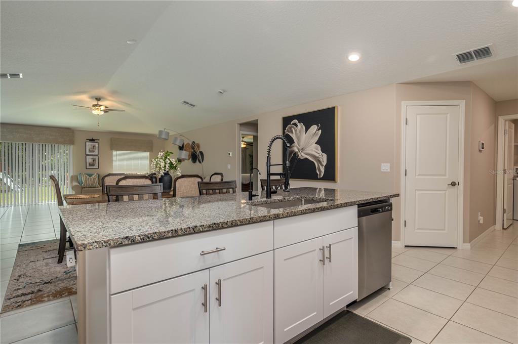 2958 Flying Blackbird Road Bartow, FL 33830 - Photo 9 of 28 a bathroom with a granite countertop double vanity sink and mirror