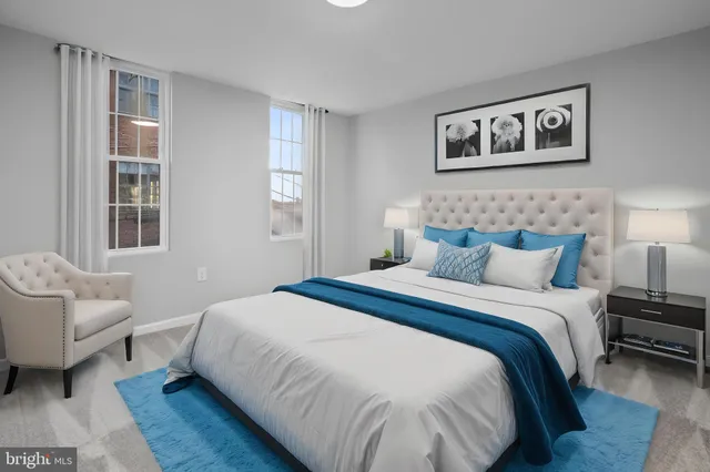 a bedroom with a bed and a couch