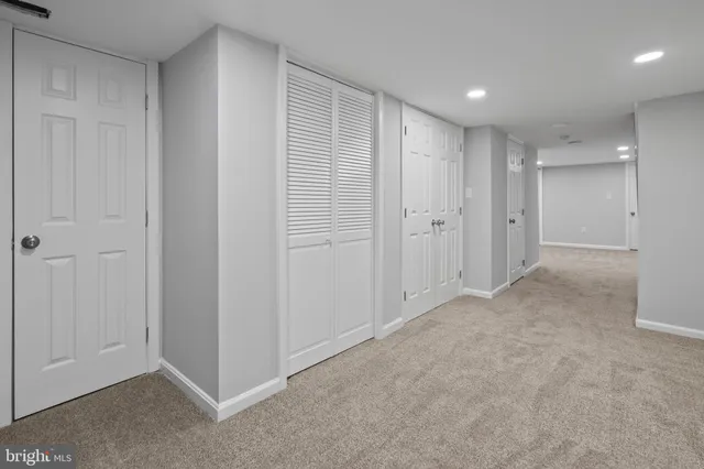 a view of an empty room with closet area
