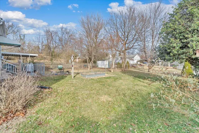 a view of a house with a backyard