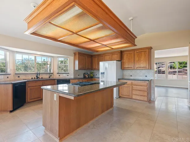 a view of a kitchen and wooden floor