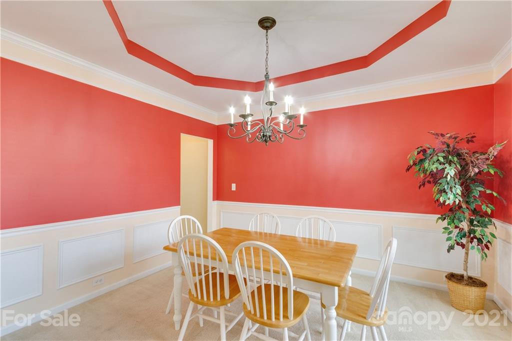 2007 Potomac Road Indian Trail, NC 28079 - Photo 4 of 29 a view of a dining room with furniture and a chandelier