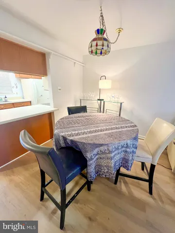 a living room with a table chairs and a table