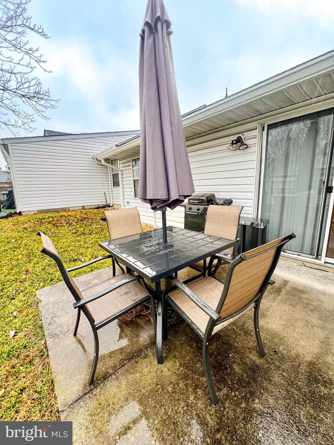 9260 Cherry Lane, Unit 34 Laurel, MD 20708 - Photo 9 of 12 a outdoor sitting area with furniture and wooden floor