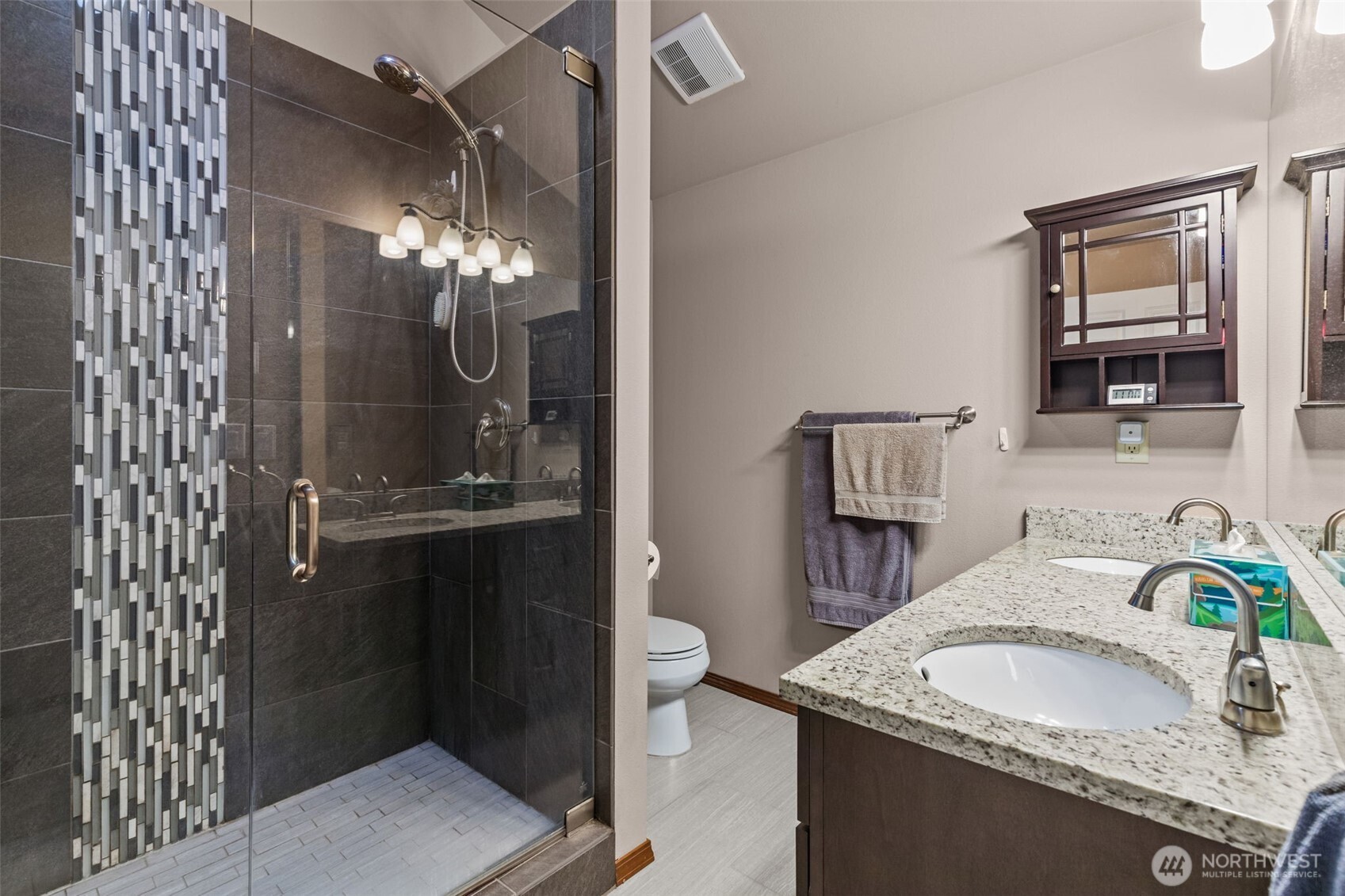 13314 Yeager Road Monroe, WA 98272 - Photo 16 of 40 a bathroom with a granite countertop sink a toilet and mirror
