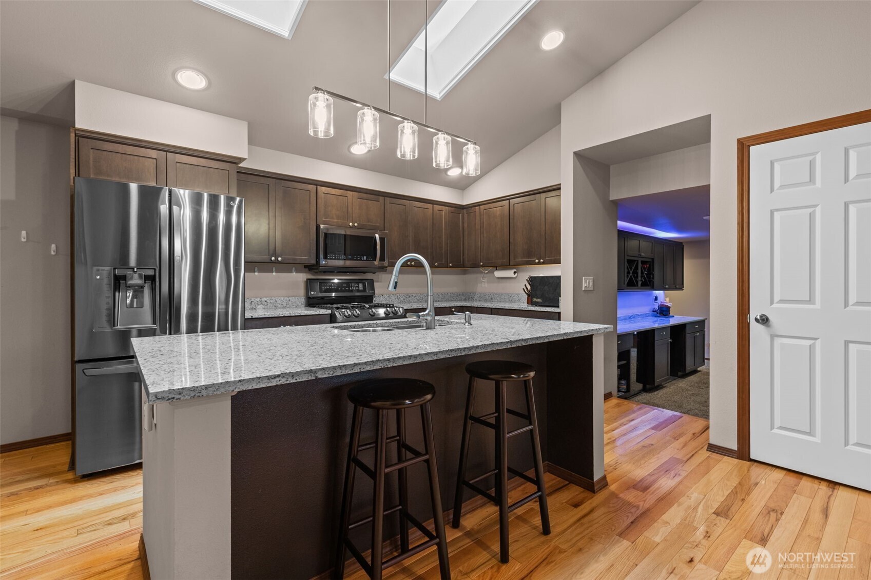 13314 Yeager Road Monroe, WA 98272 - Photo 8 of 40 a kitchen with stainless steel appliances granite countertop a table chairs sink and cabinets