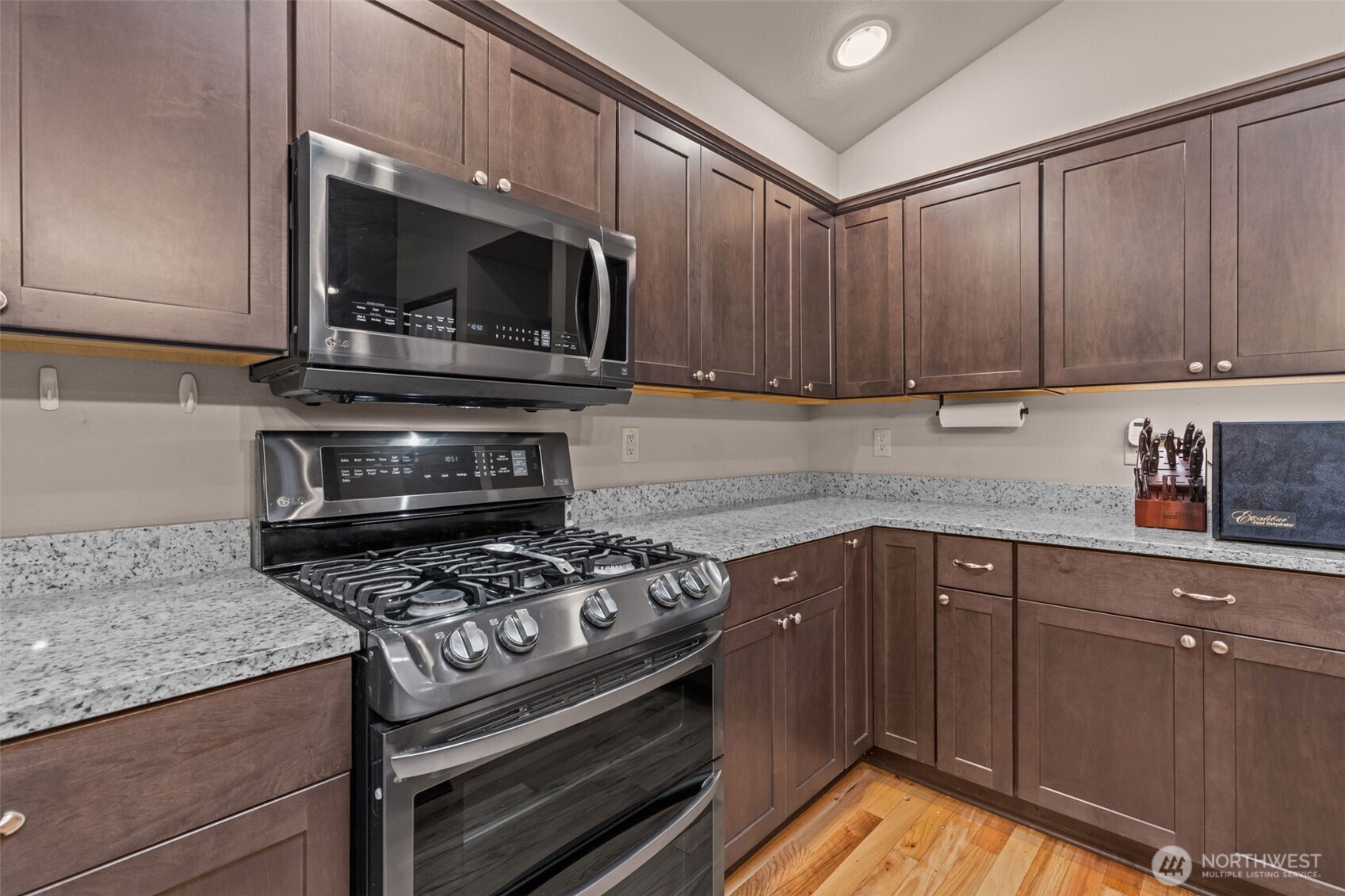 13314 Yeager Road Monroe, WA 98272 - Photo 10 of 40 a kitchen with a stove and a microwave