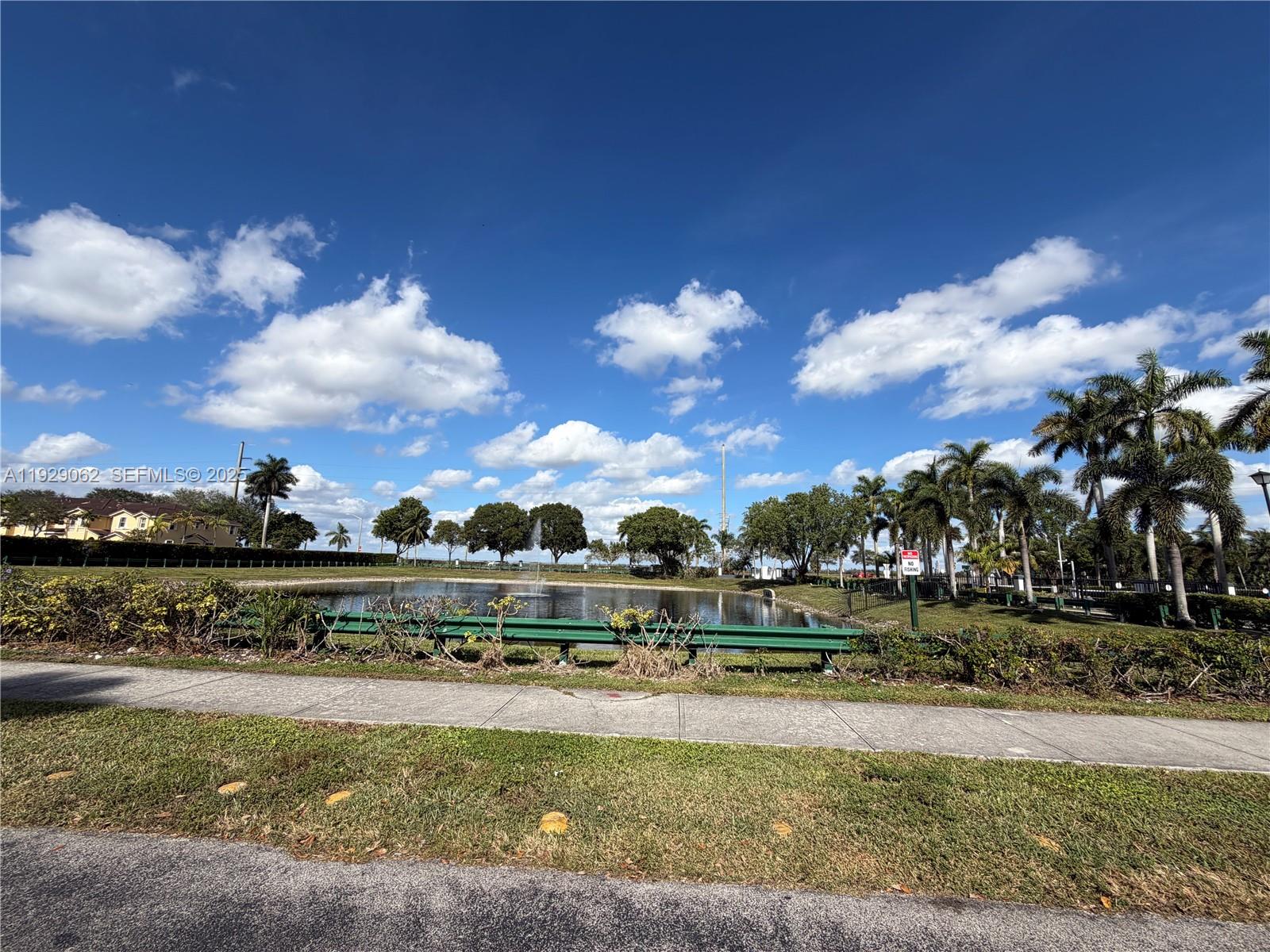 956 Southwest 148th Place Miami, FL 33194 - Photo 15 of 15 a view of a lake with a big yard