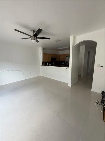 a view of a big room with carpet