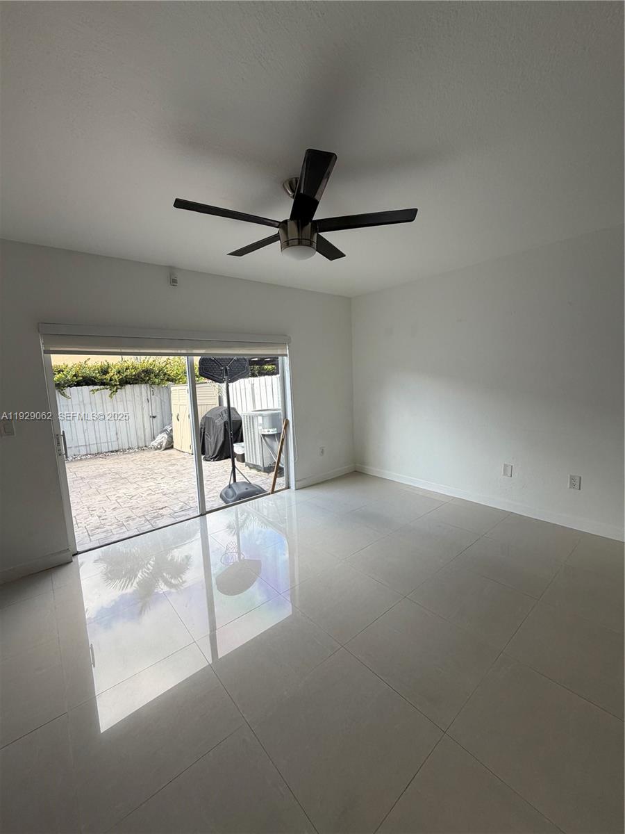 956 Southwest 148th Place Miami, FL 33194 - Photo 7 of 15 a view of a room with a ceiling fan and window