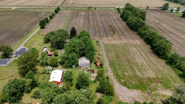 an aerial view of a house with a swimming pool