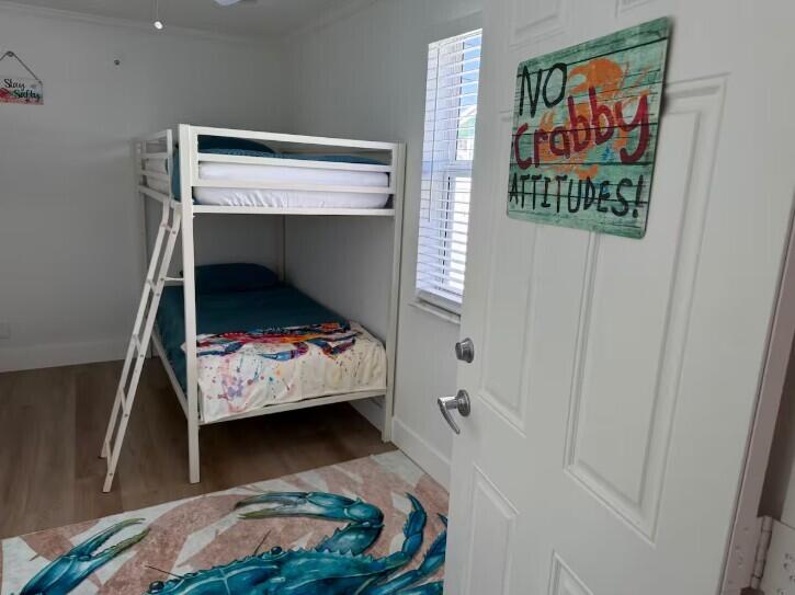 516 East Whitney Drive Jupiter, FL 33458 - Photo 15 of 47 a bedroom with a bed and a window