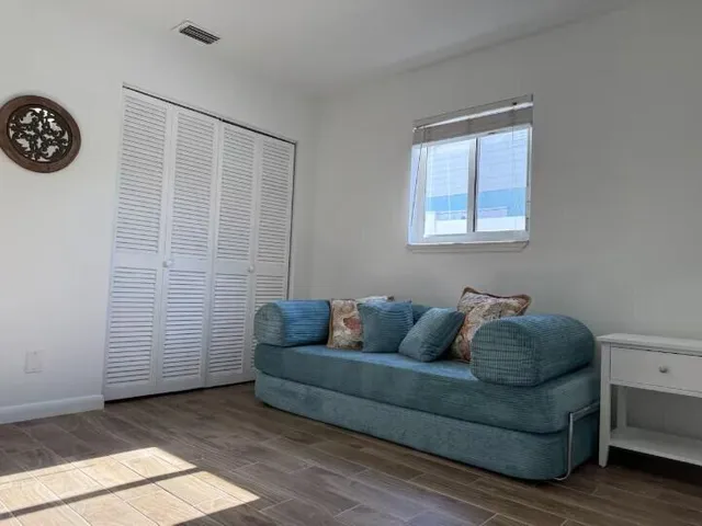 a living room with furniture and a window