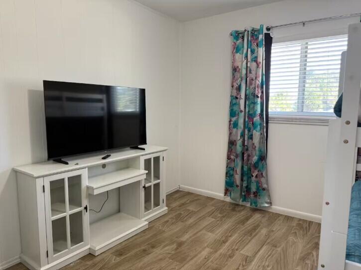 516 East Whitney Drive Jupiter, FL 33458 - Photo 29 of 47 a view of a livingroom with furniture and a flat screen tv