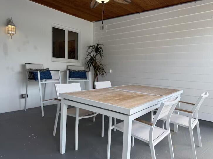 516 East Whitney Drive Jupiter, FL 33458 - Photo 33 of 47 a view of a dining space with furniture and wooden floor