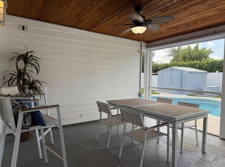 516 East Whitney Drive Jupiter, FL 33458 - Photo 34 of 47 a view of a dining room with furniture window and outside view