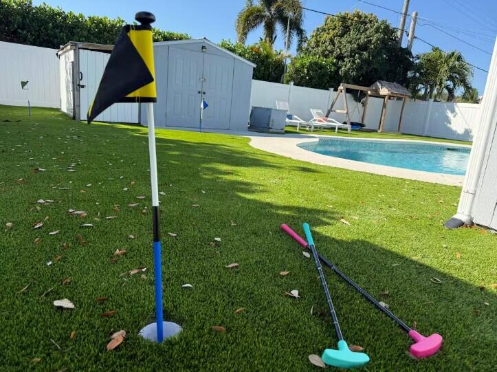 516 East Whitney Drive Jupiter, FL 33458 - Photo 35 of 47 a view of an house with backyard