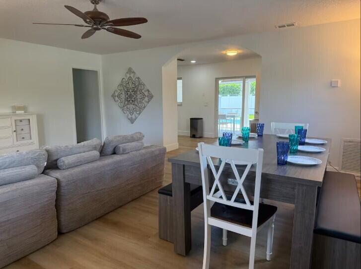 516 East Whitney Drive Jupiter, FL 33458 - Photo 4 of 47 a living room with furniture a window and a table