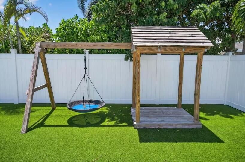 516 East Whitney Drive Jupiter, FL 33458 - Photo 45 of 47 a house view with a garden space