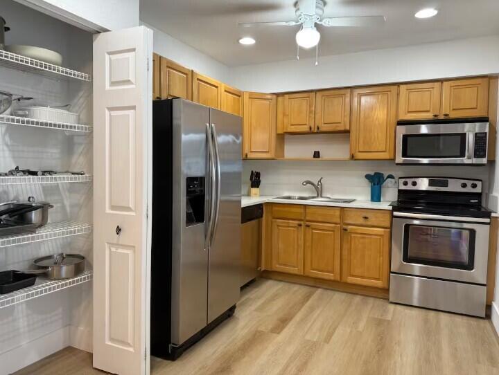 516 East Whitney Drive Jupiter, FL 33458 - Photo 6 of 47 a kitchen with stainless steel appliances granite countertop a refrigerator stove and sink