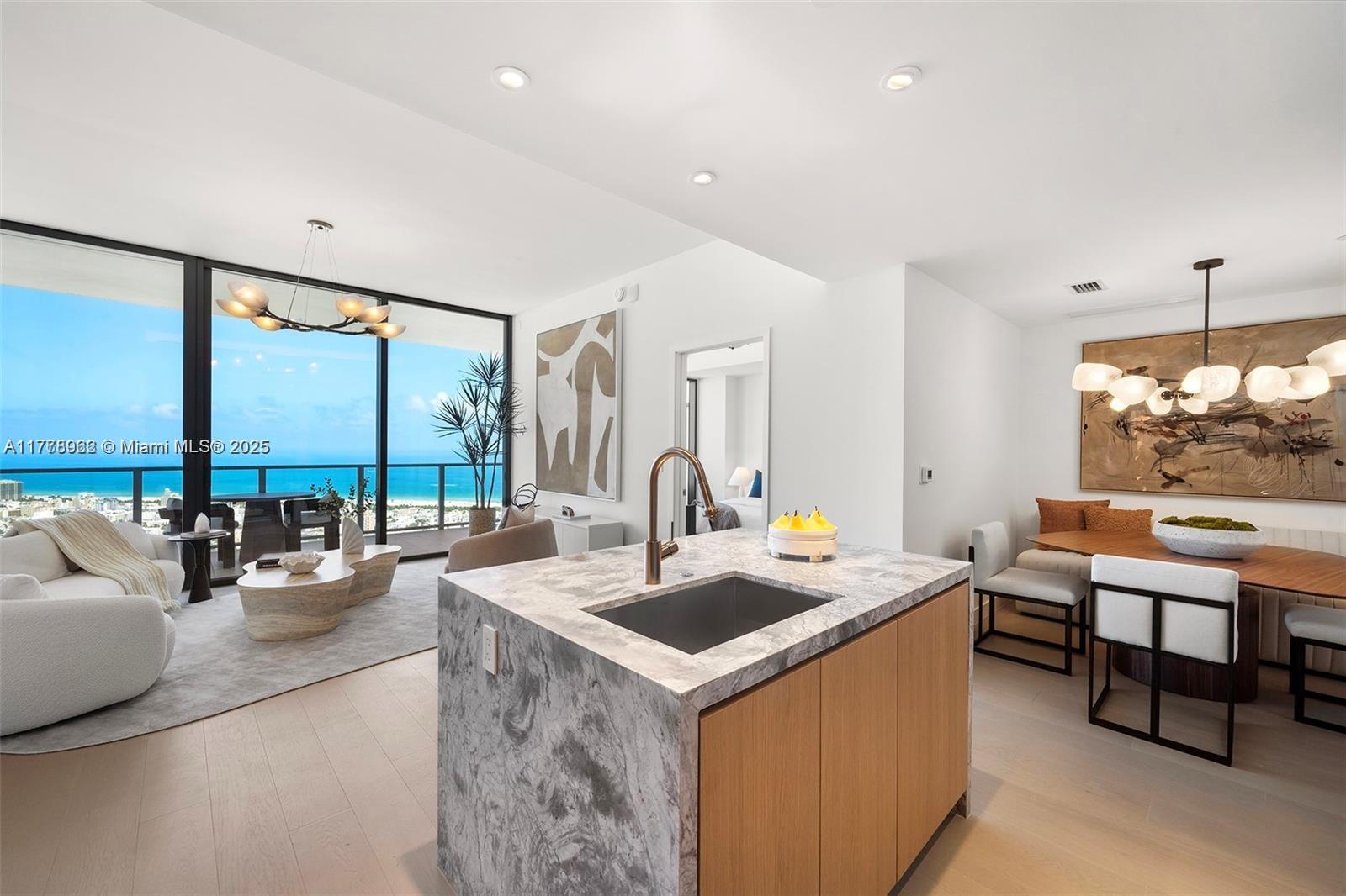 500 Alton Road, Unit 4404 Miami Beach, FL 33139 - Photo 1 of 2 a very nice looking living room with a large window and a table