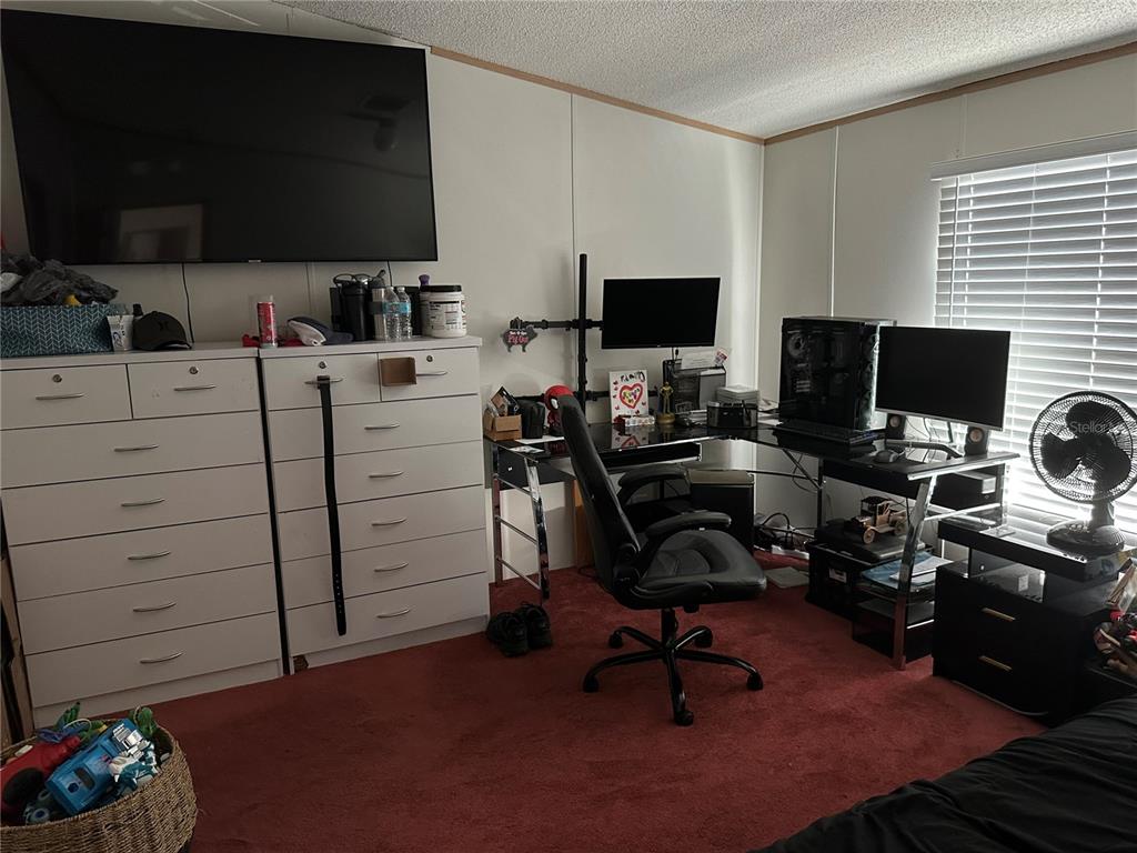 640 Southeast 10th Street Williston, FL 32696 - Photo 11 of 13 a view of a workspace with furniture