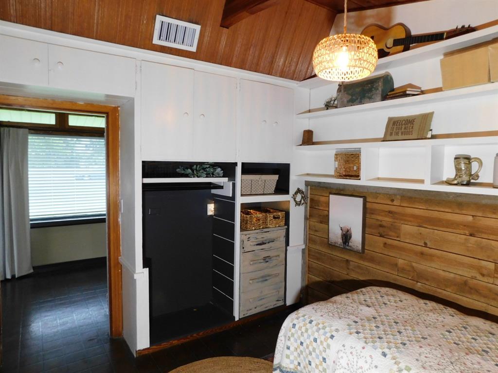 300 South Main Street Springhill, LA 71075 - Photo 23 of 35 a kitchen with a refrigerator and a stove top oven