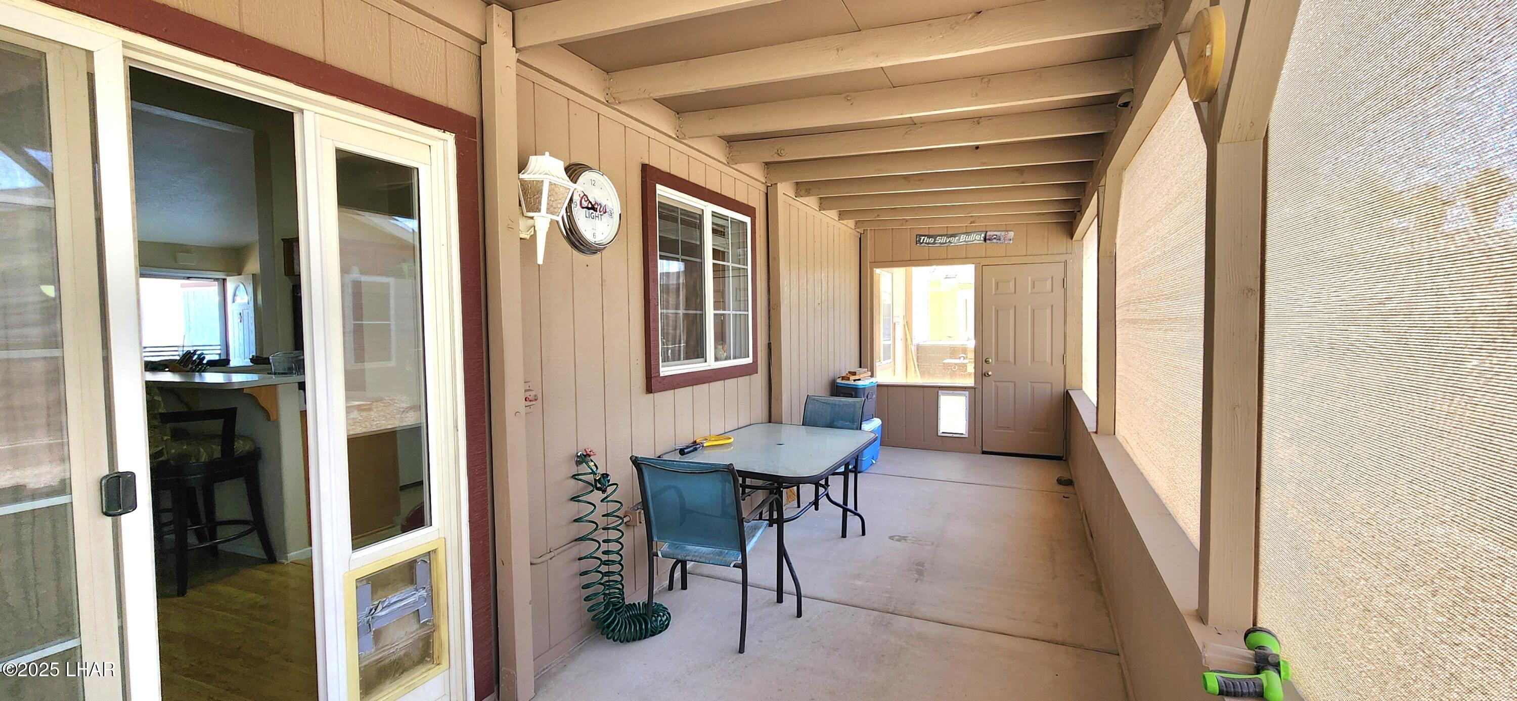 1545 East El Rodeo Road, Unit LOT 18 Fort Mohave, AZ 86426 - Photo 15 of 78 Sun room (enclosed patio)