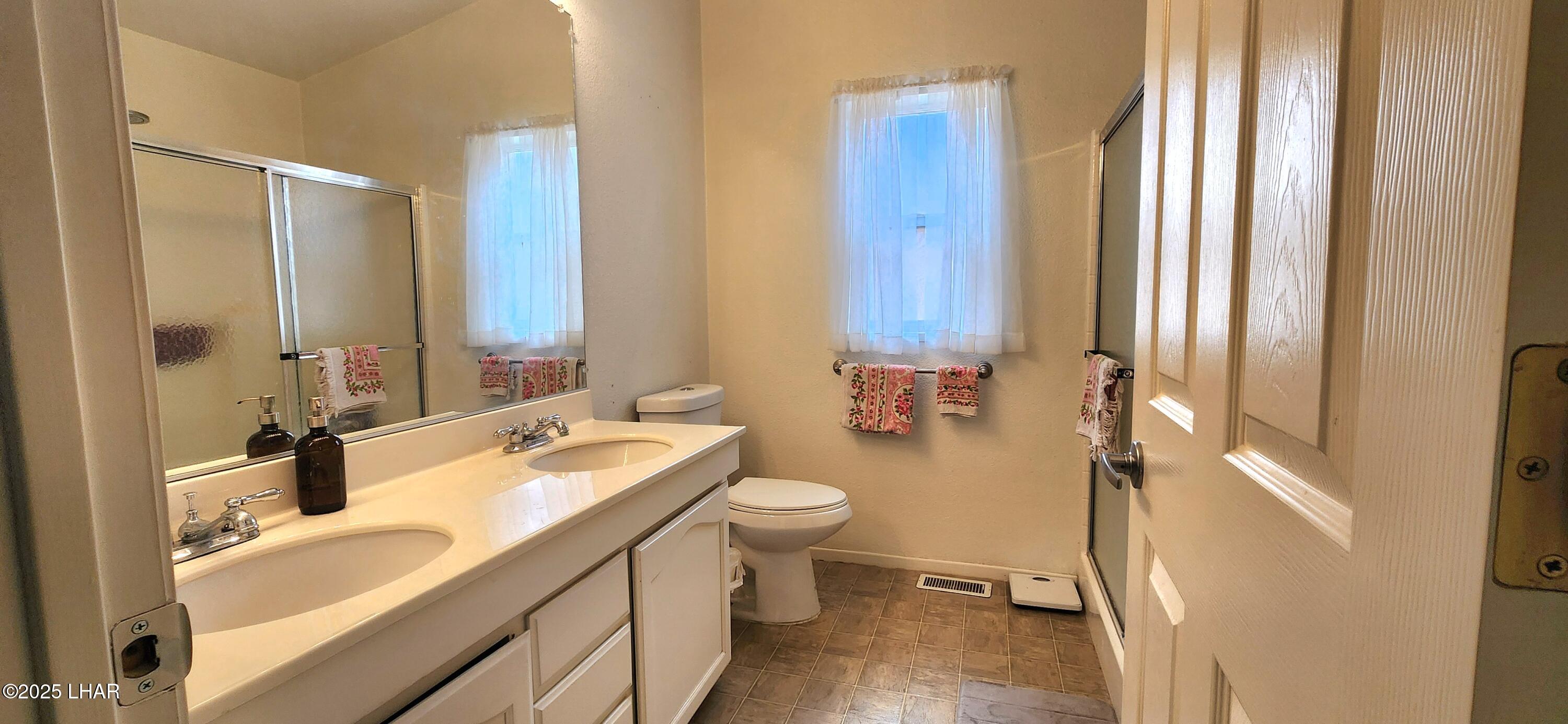 1545 East El Rodeo Road, Unit LOT 18 Fort Mohave, AZ 86426 - Photo 23 of 78 Primary Bathroom