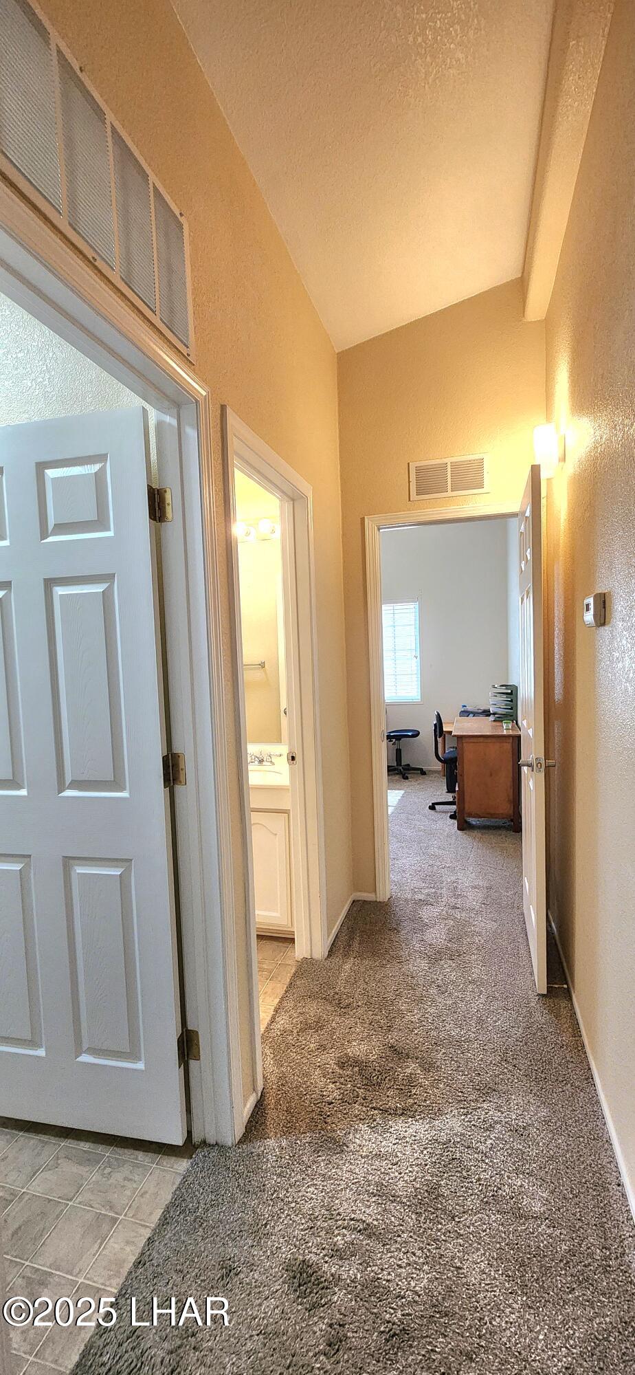 1545 East El Rodeo Road, Unit LOT 18 Fort Mohave, AZ 86426 - Photo 29 of 78 Hallway from Primary Bedroom