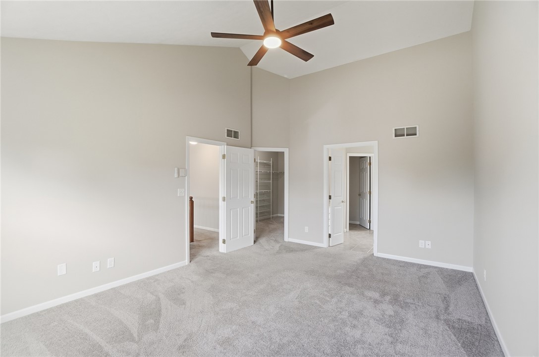 10 Chase Court Springboro, OH 45066 - Photo 35 of 75 This spacious bedroom offers high vaulted ceilings and plush carpeting.