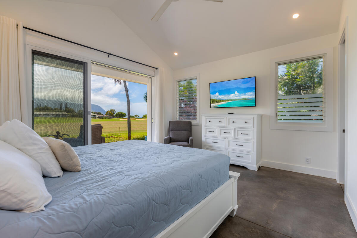 3868 Punahele Road Princeville, HI 96722 - Photo 12 of 24 a bedroom with a bed and a flat screen tv
