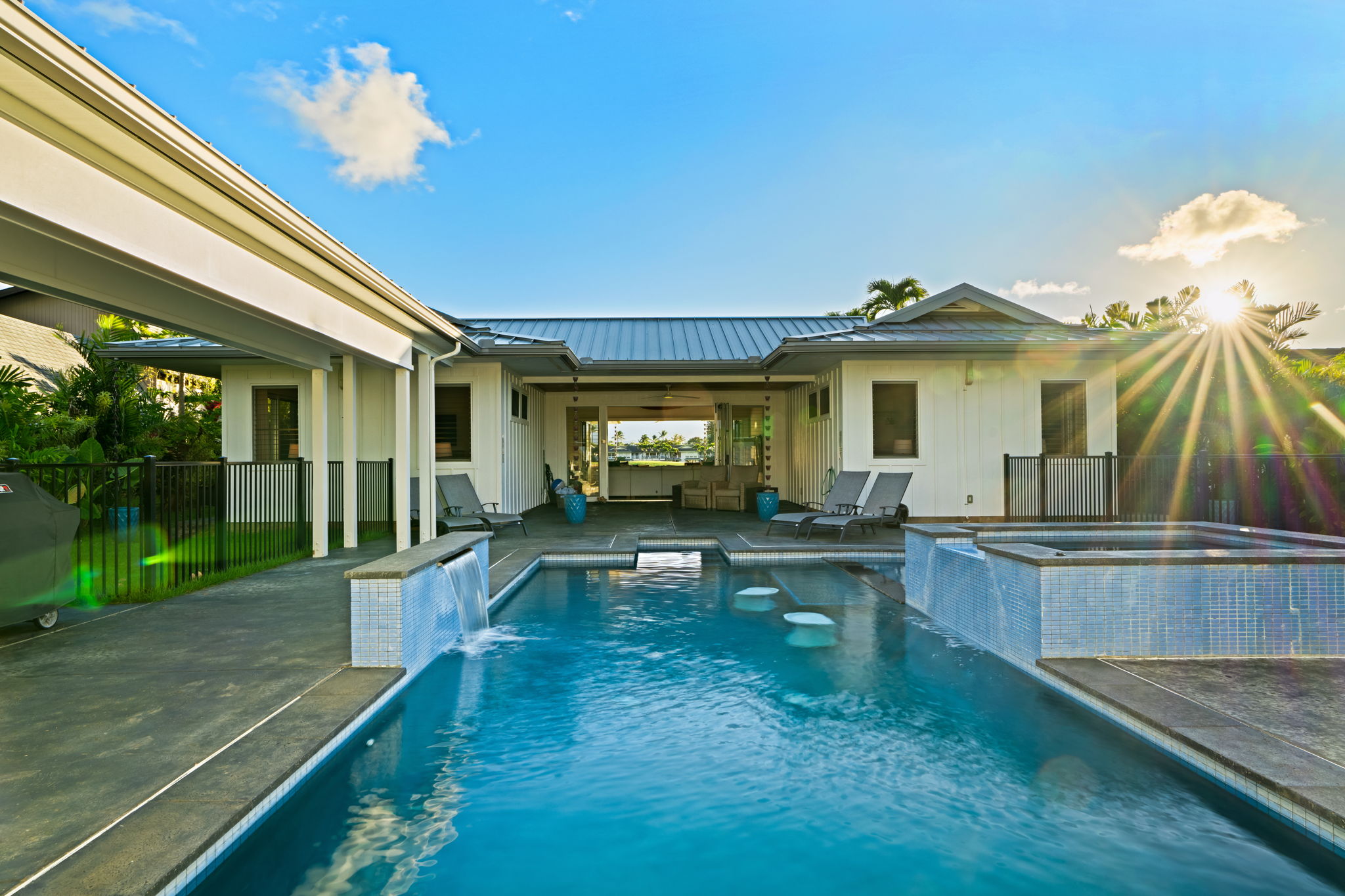 3868 Punahele Road Princeville, HI 96722 - Photo 20 of 24 a view of a house with swimming pool