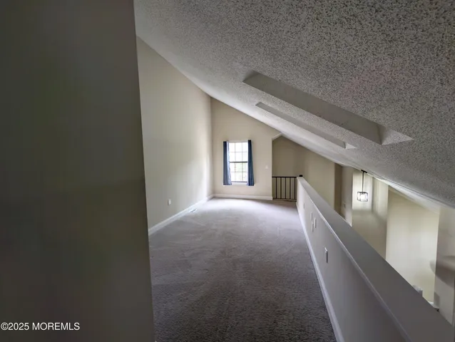 a view of a hallway with windows