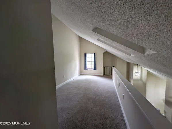 a view of a hallway with windows