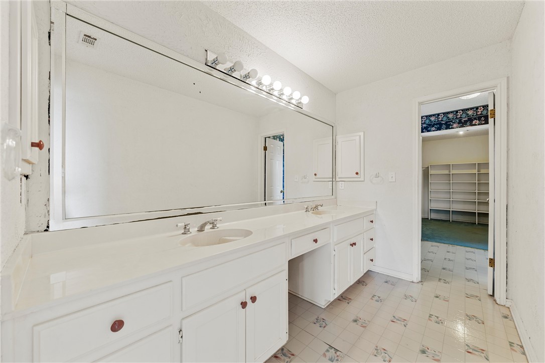 807 Birdie Lane Lorena, TX 76655 - Photo 12 of 32 a spacious bathroom with a double vanity sink a mirror and shower