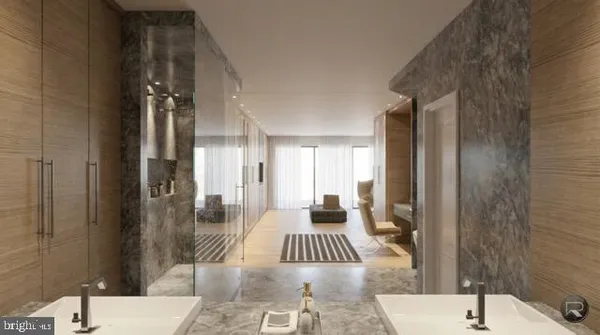 a bedroom with a bed and glass door