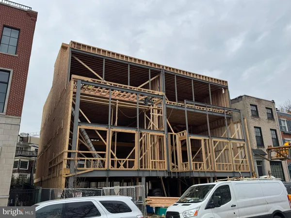 a front view of a building with parking space and parking space