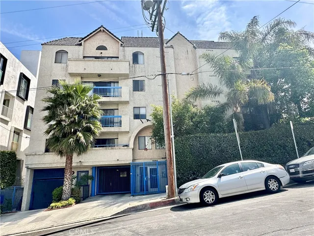 a view of a car parked in front of a house