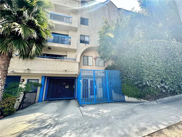 a view of a house with a yard and garage