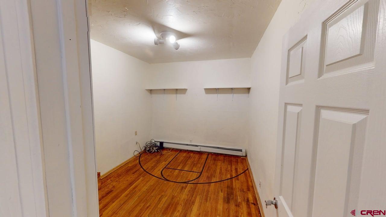 807 13th Street Alamosa, CO 81101 - Photo 14 of 31 a view of a room with wooden floor