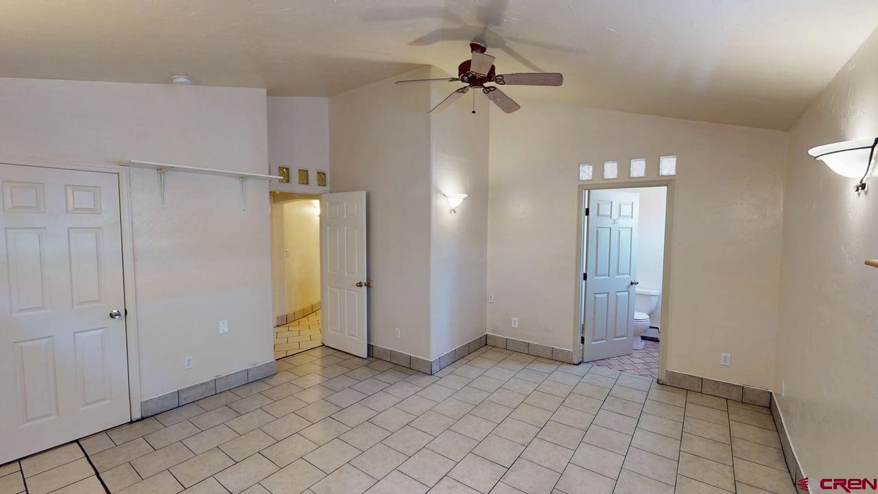 807 13th Street Alamosa, CO 81101 - Photo 18 of 31 wooden floor in an empty room