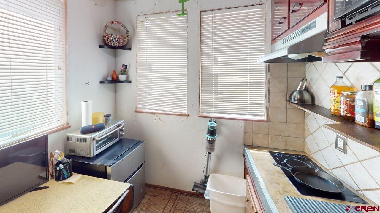 807 13th Street Alamosa, CO 81101 - Photo 26 of 31 a view of a workspace with furniture and a window