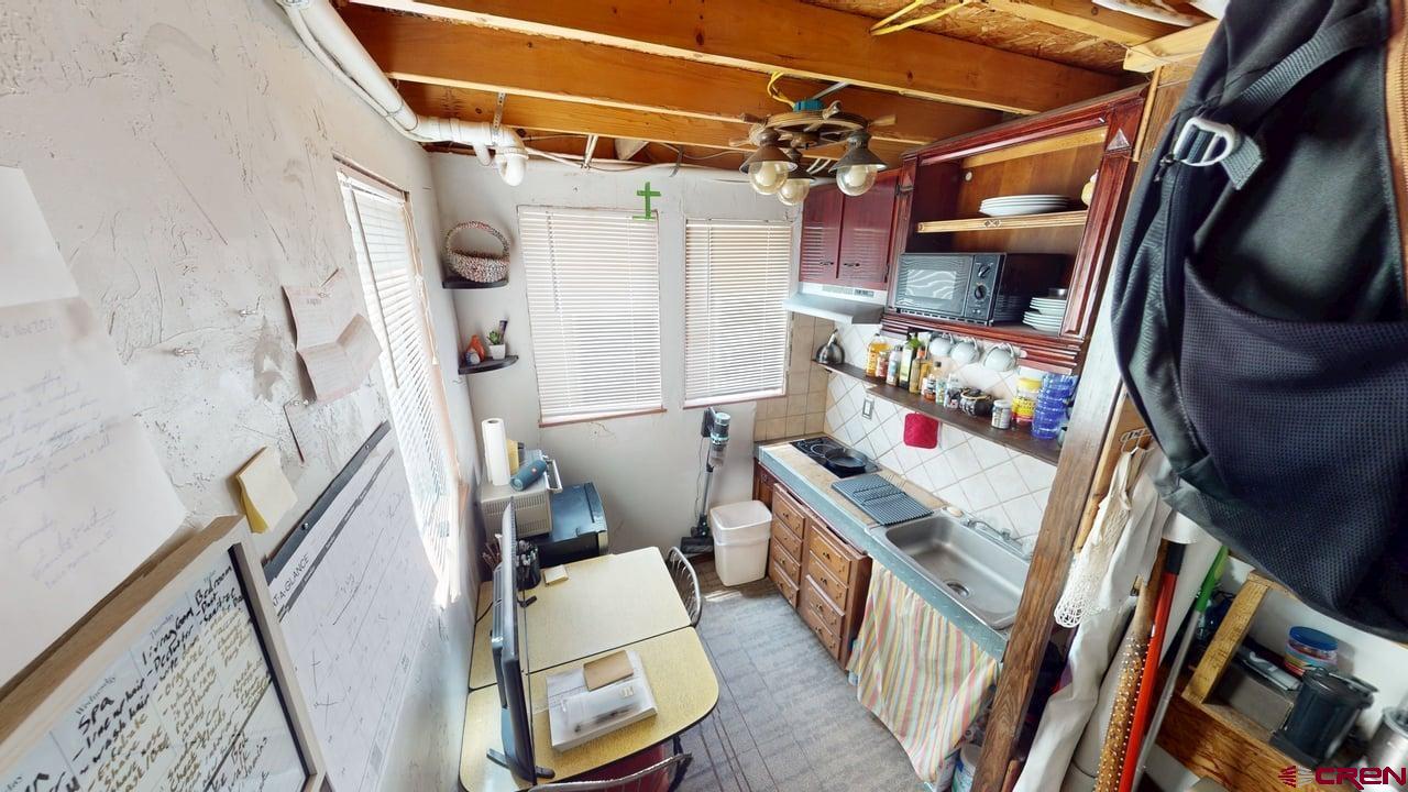 807 13th Street Alamosa, CO 81101 - Photo 28 of 31 a utility room with furniture dryer and washer