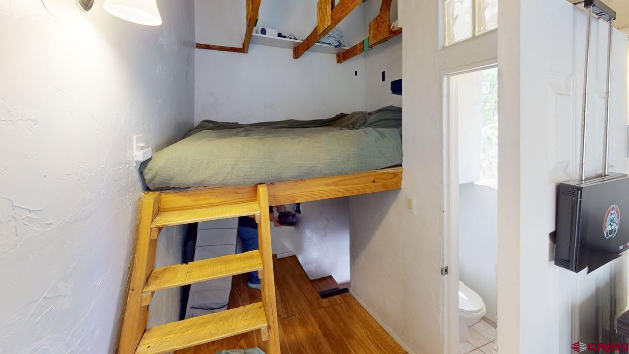 807 13th Street Alamosa, CO 81101 - Photo 30 of 31 a view of walk in closet with clothes and shoes