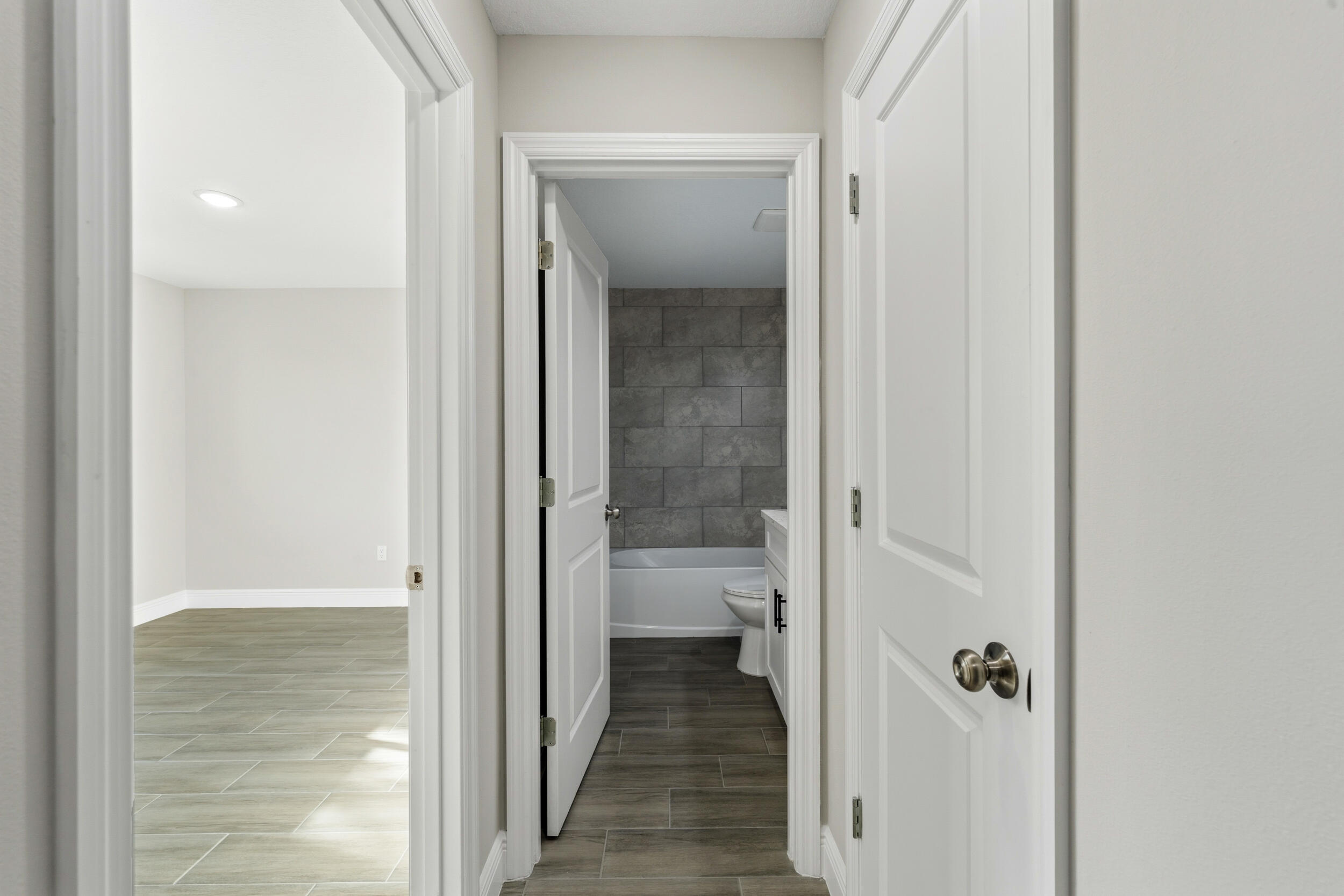 4335 Southwest 15th Way Okeechobee, FL 34974 - Photo 24 of 33 a view of a bathroom from a hallway