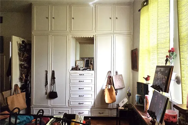 a view of room with wooden floor and windows