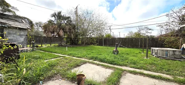 a garden view with a fountain
